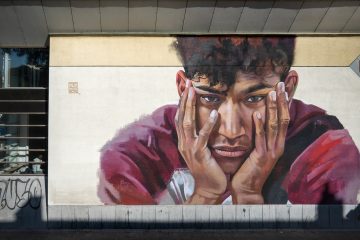 A mural of Sanda Dia on the wall of a lecture hall in Leuven, Belgium