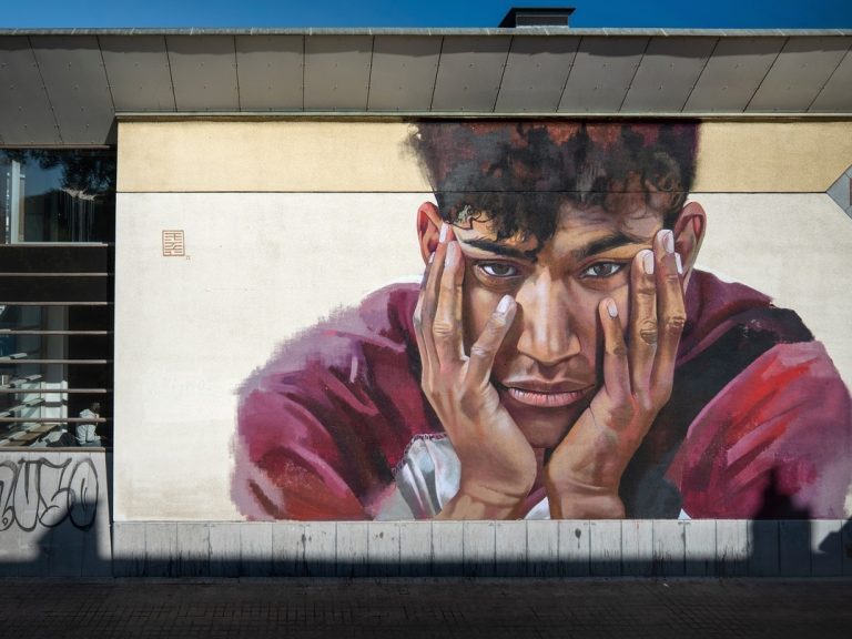 A mural of Sanda Dia on the wall of a lecture hall in Leuven, Belgium
